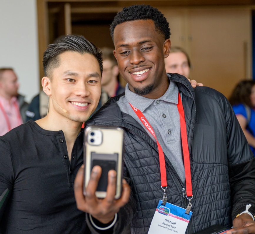 Keynote Speaker and American Ninja Warrior Hoan Do connecting with an audience member.